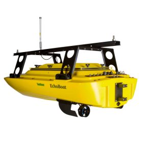 A small yellow Seafloor Echoboat 160™ with a motor attached to it.