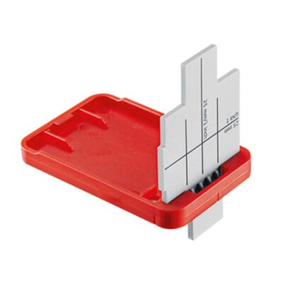 Red and gray measurement tool for thickness.