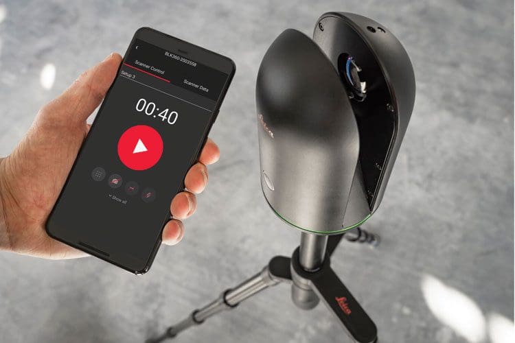 Smartphone controlling 3D laser scanner on tripod.
