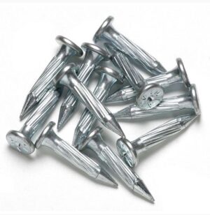 A pile of metal nails on a white background.