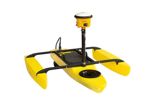 A yellow Seafloor TriDrone™ G2 USV with a camera attached to it.