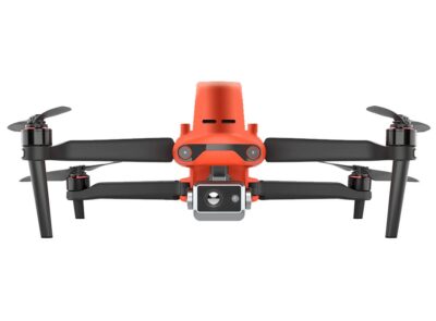 Orange drone with camera, front view.