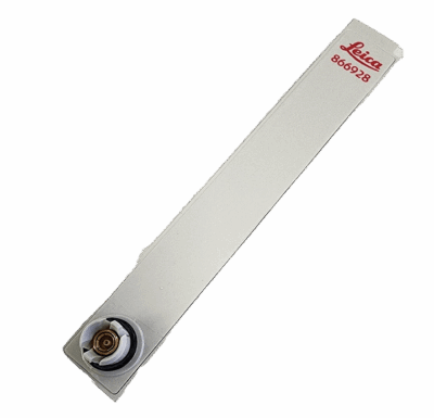 White Leica blade holder on black background.