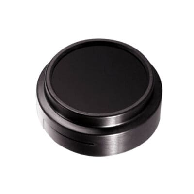 Round black object with a metallic edge.