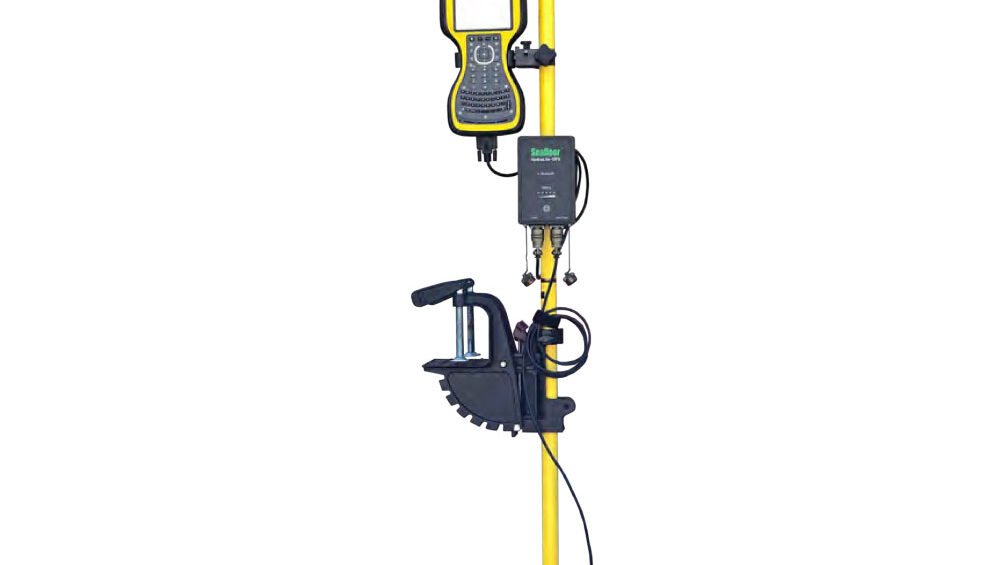 A yellow pole with a Seafloor Hydrolite TM Plus Echosounder Kit attached to it.