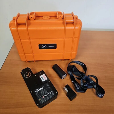 Orange case with electronic components on table.