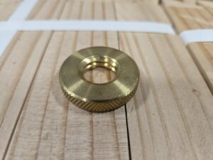 Brass threaded insert on wood.