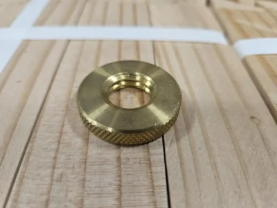 Brass threaded insert on wood.