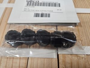 Five black SVR buttons in package.