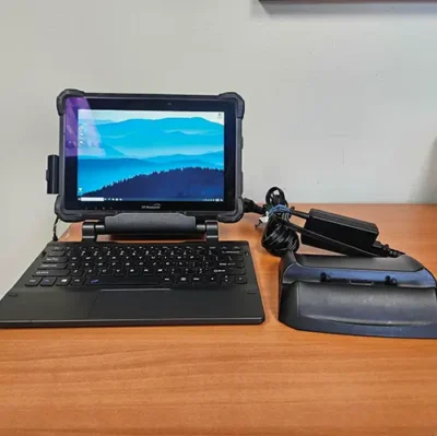 Tablet with keyboard and charging dock setup.