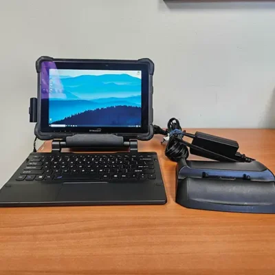 Tablet with keyboard and charging dock setup.