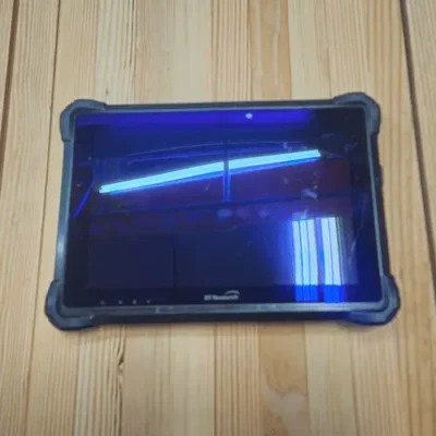 Rugged tablet on wooden surface.