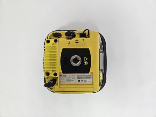 Laser level device, top view, yellow color.