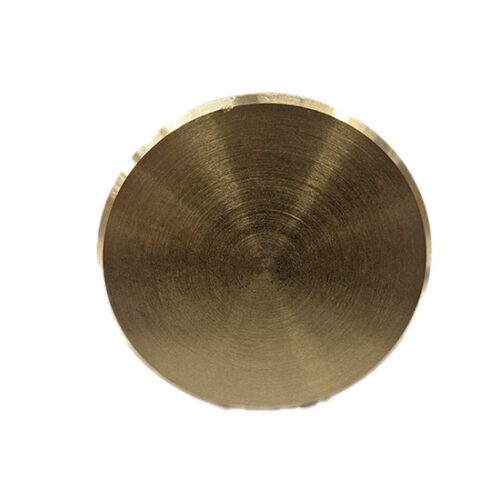 Brass circular metal piece with smooth surface.