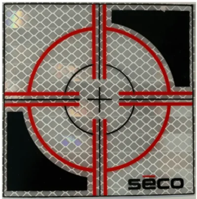 Reflective target with red and black design.