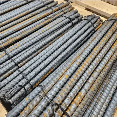 Stacked steel rebar on wooden pallets.