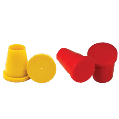 Red and yellow plastic caps on black.